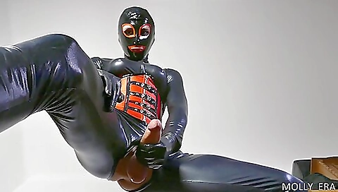 Sexy brunette in a red dress takes her big cock in her feet