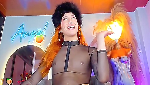 Redhead in a tattooed pussy is showing off her big cock