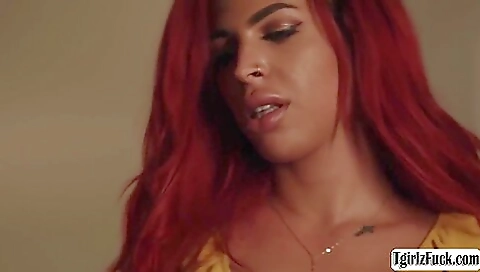 Busty red head fucking black cock in a hardcore way
