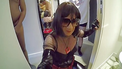 A sexy shemale in latex takes his dick inside her anus