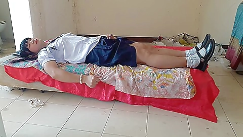 Sexy asian teen plays with her body in a school uniform